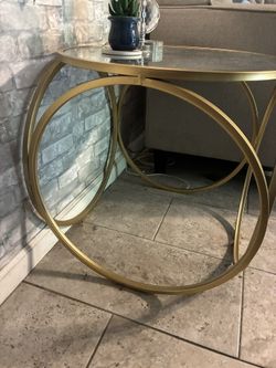 Brass Colored End Table With Glass Top