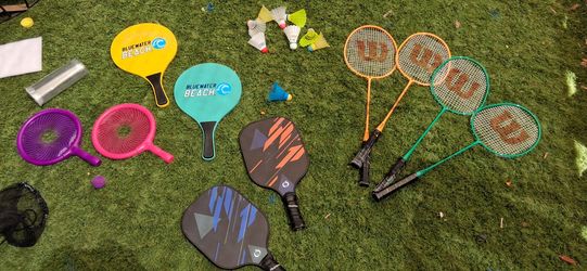 set features four rackets with orange and green frames