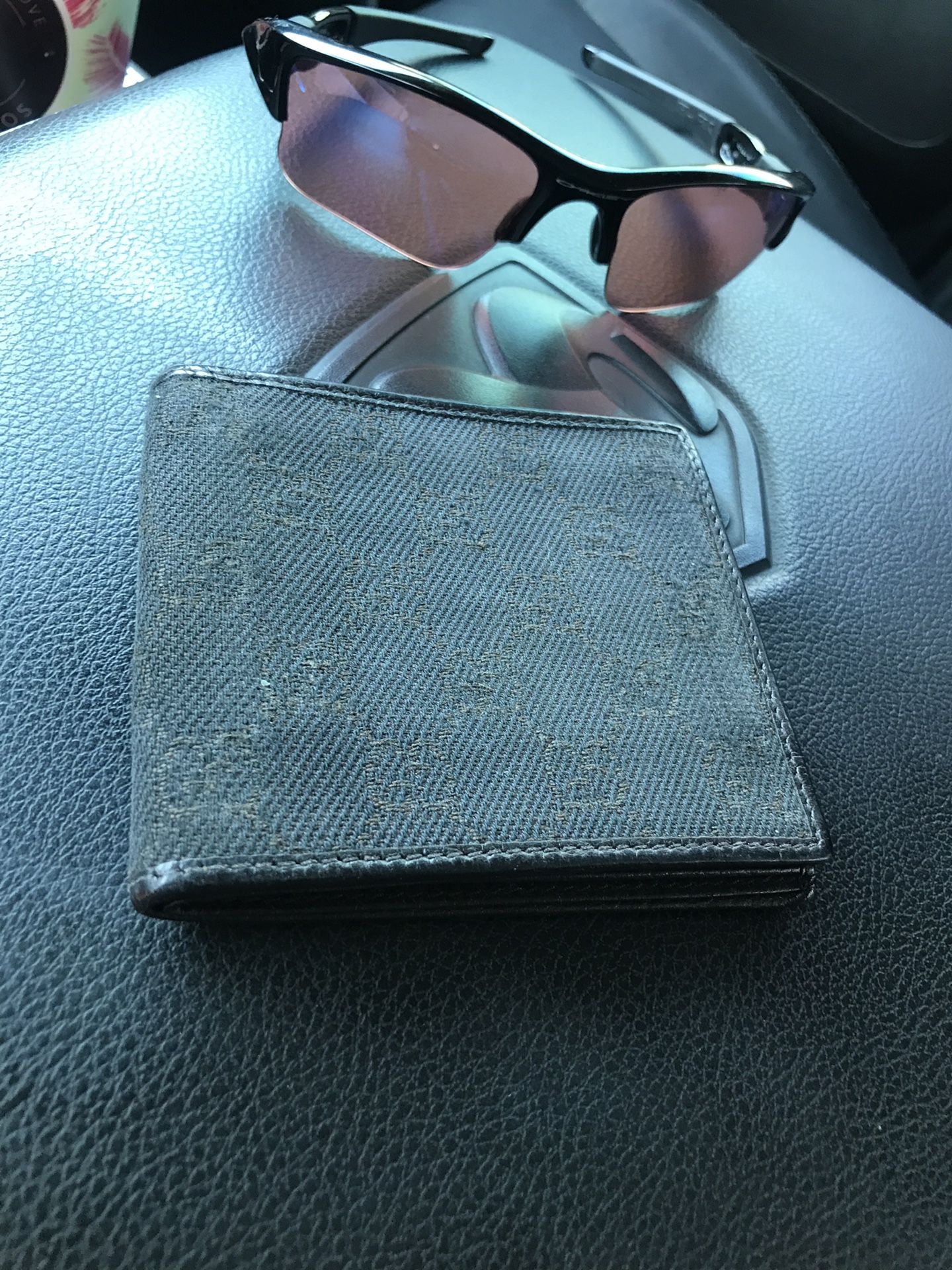 Gucci wallet. Oakley sunglasses