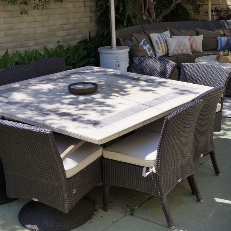 Massive marble outdoor dining table with 8 wicker chairs 110” square