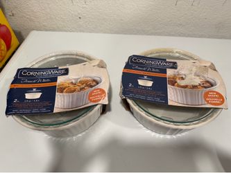 New corningware casserole dishes with lids. Two complete sets.