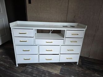 Dresser with a outlet on top led light with 11 drawers and cubby in the middle
