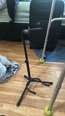 Black tripod guitar stand