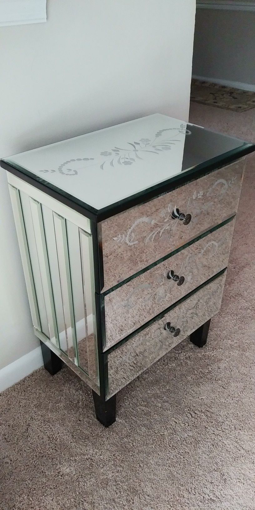 Chest of drawers covered in mirrors