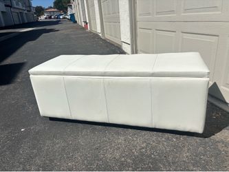 White faux leather storage ottoman/bench