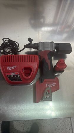 Used Rivet gun Milwaukee 12v charger and one battery included