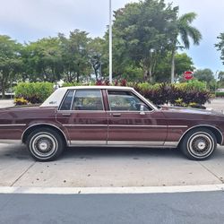 83' OLDSMOBILE 15" HUBCAPS 