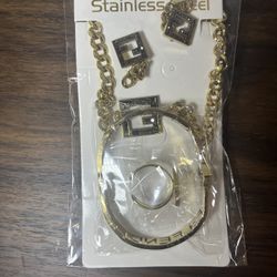 gold-tone stainless steel Fendi-style jewelry set including a necklace, bracelet, earrings, and ring.
