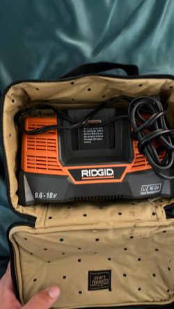 Rigid battery, charger, and case.