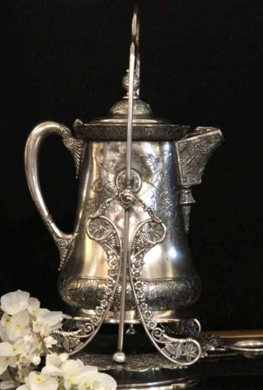 Silver plate Tilting Water Pitcher From Victorian Aesthetic Era