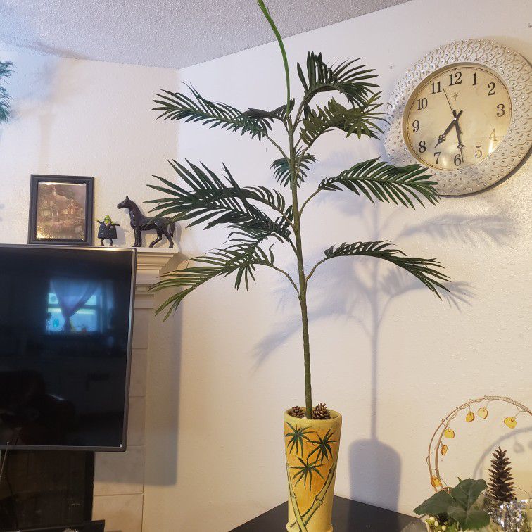 Pot Plant with  fake palm tree .