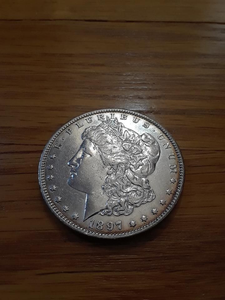 Vintage coins. 1897 O Morgan  Silver Dollar very nice condition hard to find in high grade. 