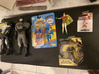 Assorted Marvel/DC Action Figures And Comics