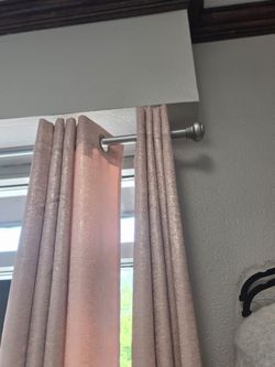Pink curtains and silver curtains rod