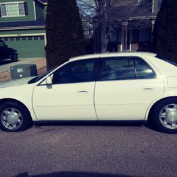 Cadillac deville 2001 1000 or car and rims 2500 26" brand new tires never rode on will need tow because been setting fo a year or jump it