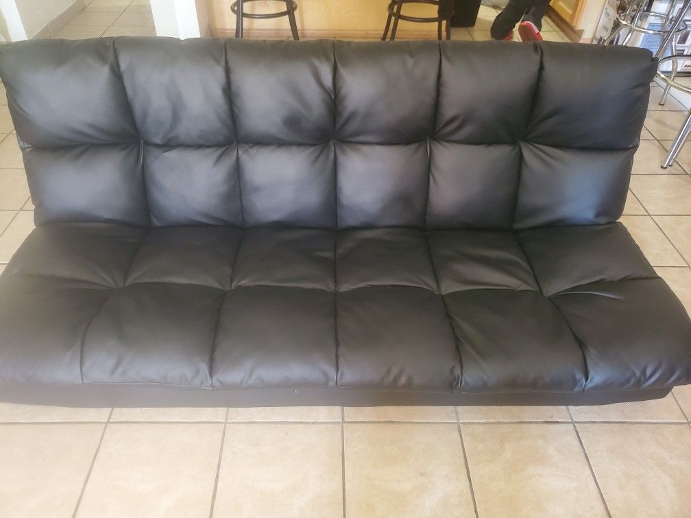 Leather futon converts to full size bed