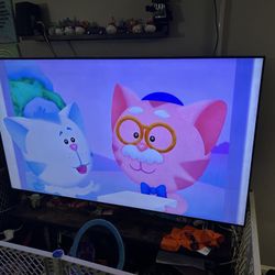 70” 4 K TV With Entertainment Stand