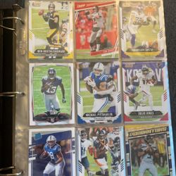 hundreds of football, baseball, and basketball cards