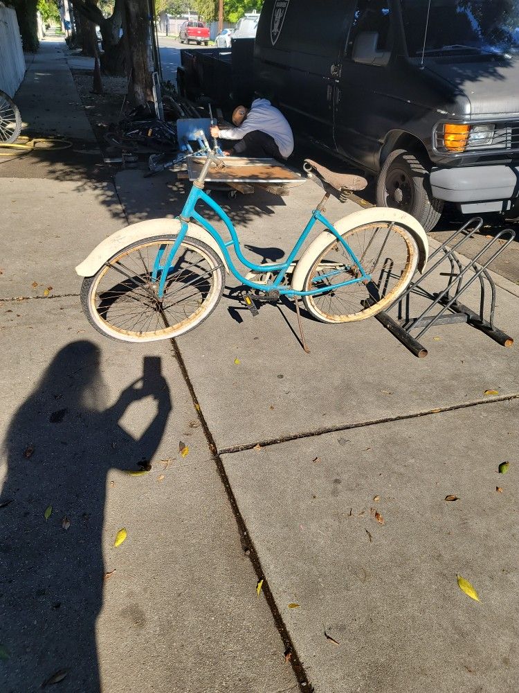 vintage Schwinn Hollywood ladies beach cruiser bicycle in a light blue or turquoise color.