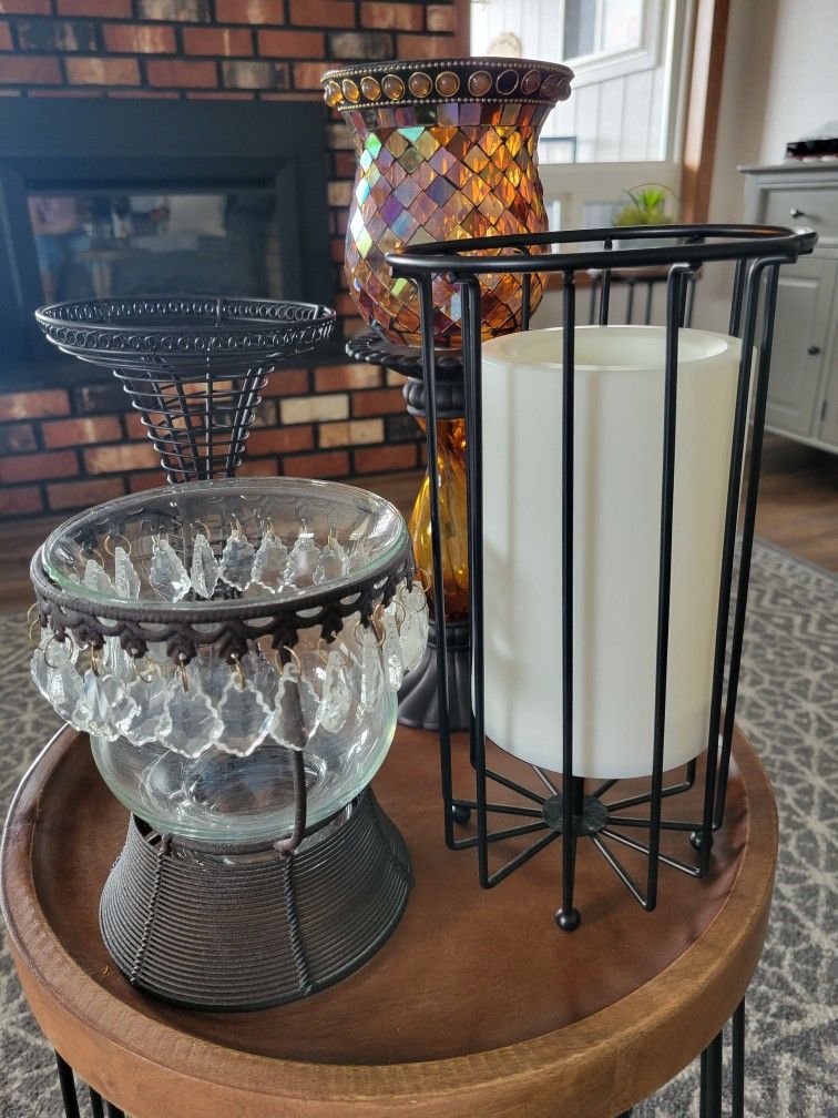 OIL RUBBED BRONZE COLOR CANDLE COLLECTION. 4 PIECES. COMES WITH BATTERY OPERATED TIMER CANDLE. ALL IN EXCELLENT CONDITION.