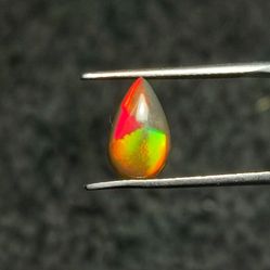 A Rare Find: 1.2 ct Pear-Shaped Broadflash/Cloverleaf Opal