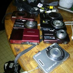 7 Digital Camera And Bunch Of Cables