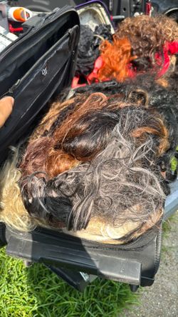 Two bags of random wigs