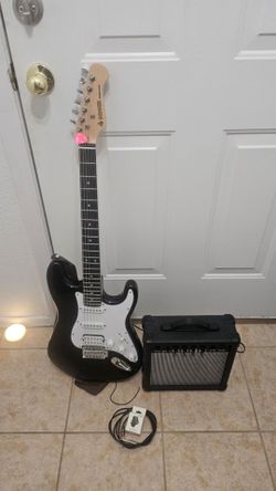 Electric guitar with amplifier