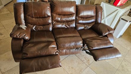 Brown leather couch with 2 leg recliners