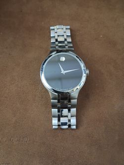 Original Men's Movado quartz watch stainless steel some scratches on the back  from putting a new battery in works excellent 225 or best offer