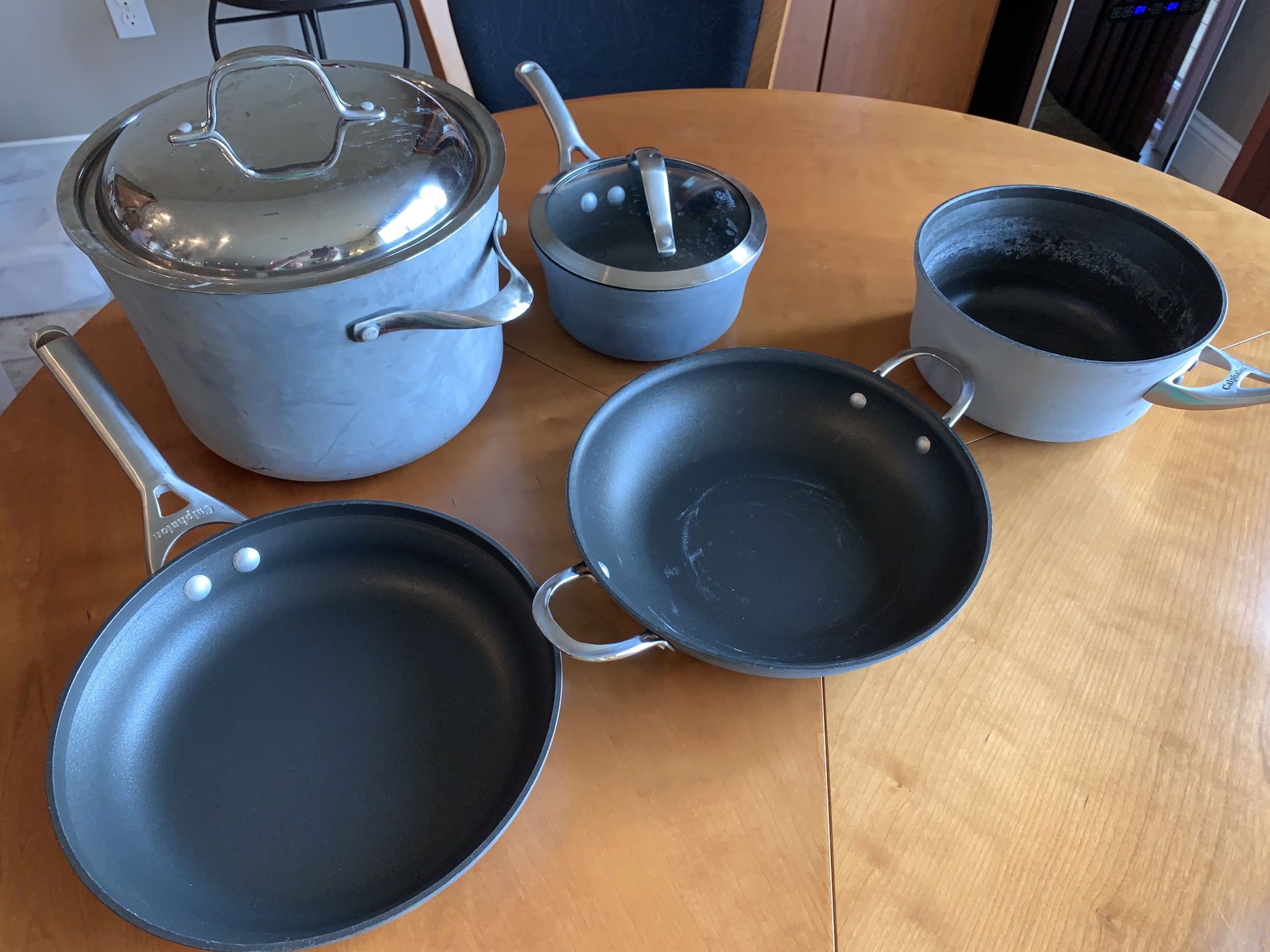 7 piece Calphalon Pots, Pans. Lids