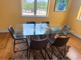 Modern glass top dining table and chairs