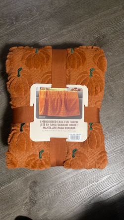 Embroidered faux throw