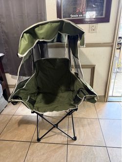 portable folding camping chair with a built-in privacy canopy, designed to provide shade and added seclusion while relaxing outdoors.