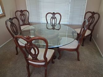 Glass top dining table and 6 chairs