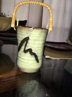 Cute ceramic pot with wither handle