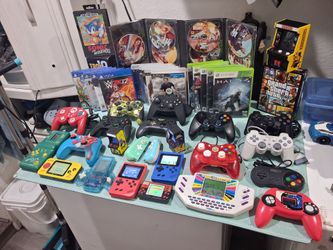 Selling All these games and controllers,  everything for 270. Good condition. 

11 small electronic games...

-red Vintage MGA Super auto racing game 