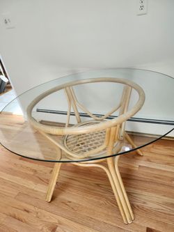 Rattan table with 4 chairs  glass top  Excellent Condition
