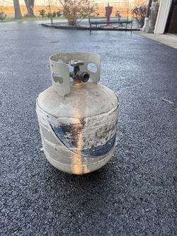 Empty 20 lb propane tank.