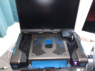 Gaems Guarding pro xp console Laptop gaming environment with Monitor and surround sound
