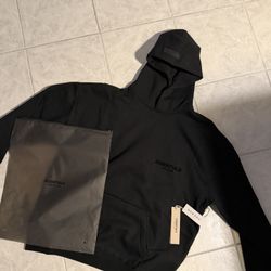 size xs and large black essentials hoodie