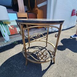 Table with granite top and glass shelf