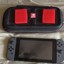 Nintendo Switch with case, charging dock and game holders