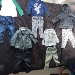 Baby gap boys 18-24m clothes. 2 pairs of pants are osh kosh. Star Wars shirt glows in dark. White/green shirt has light stain on wrist. Lightning bolt