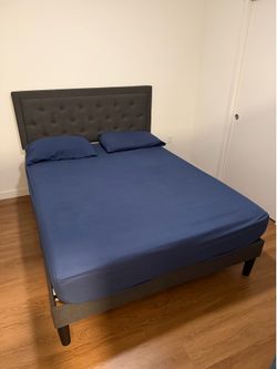 Queen size upholstered bed