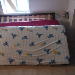 Twin bed with box Spring, mattress and an extra cushion Up top