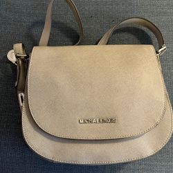 Michael Kors crossbody saddle bag/silver grey color