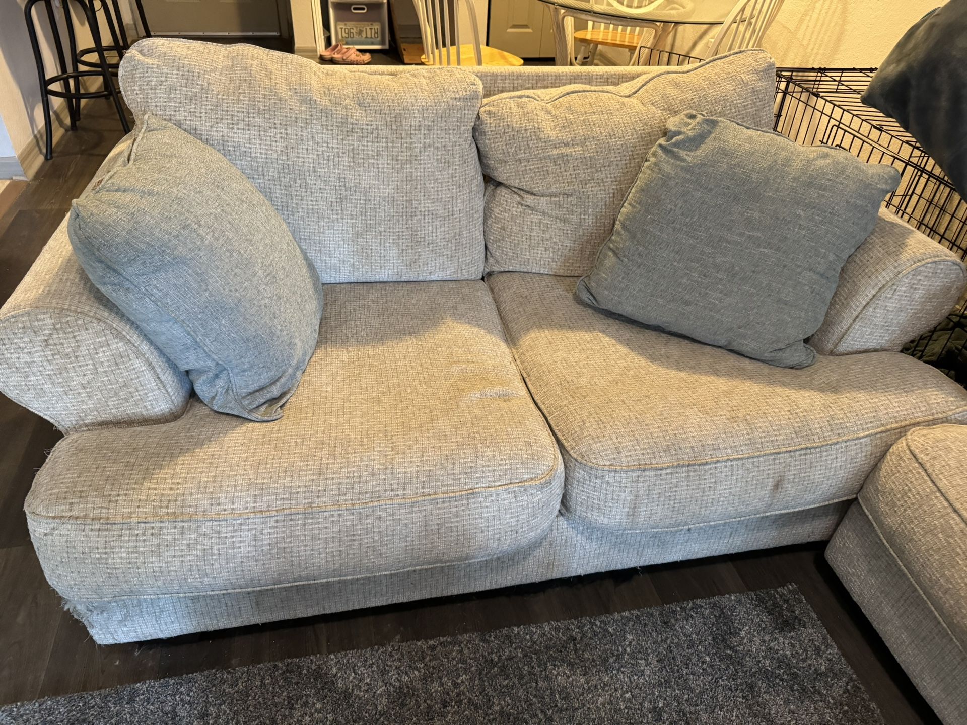 light tan/cream love seat w 2 pillows