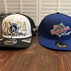2 never been worn Dodger hats.