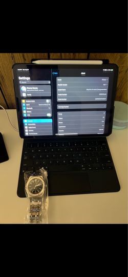 Apple iPad Pro 11-inch (2nd generation) paired with a Magic Keyboard and an Apple Pencil